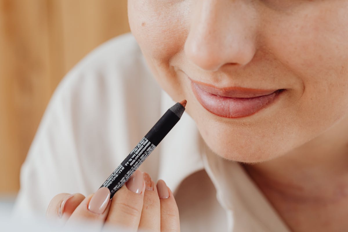 A beautiful, close-up view of healthy, neutralized lips on a person with melanin-rich skin