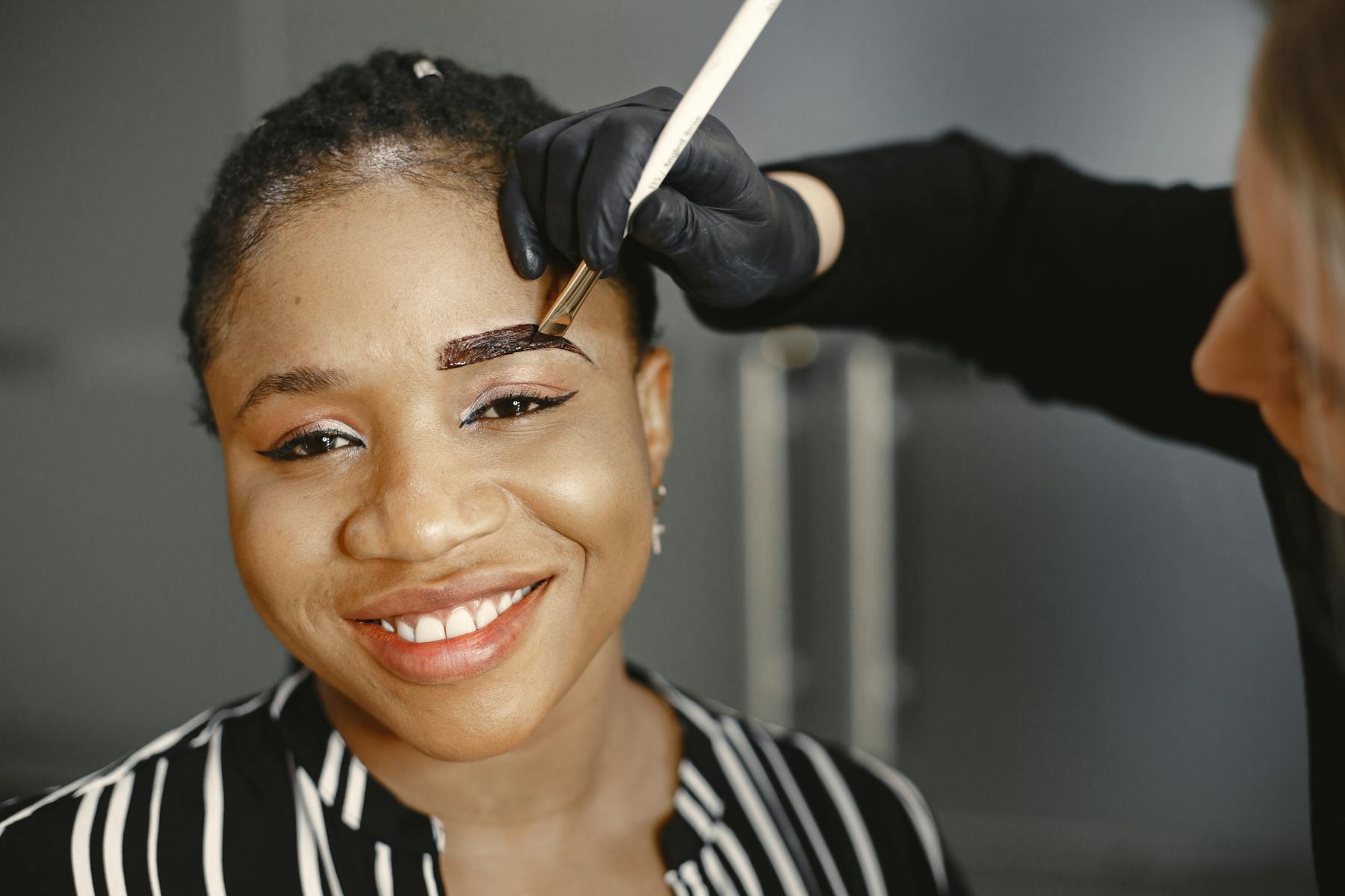 A professional display of permanent makeup tools and artistic precision, representing the high standard of ombre powder training