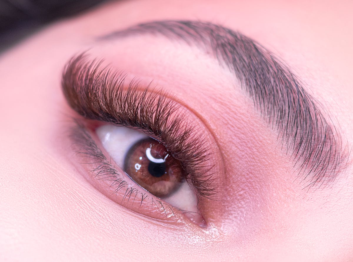 A serene image of someone practicing careful facial aftercare, representing the dedication required for brow healing